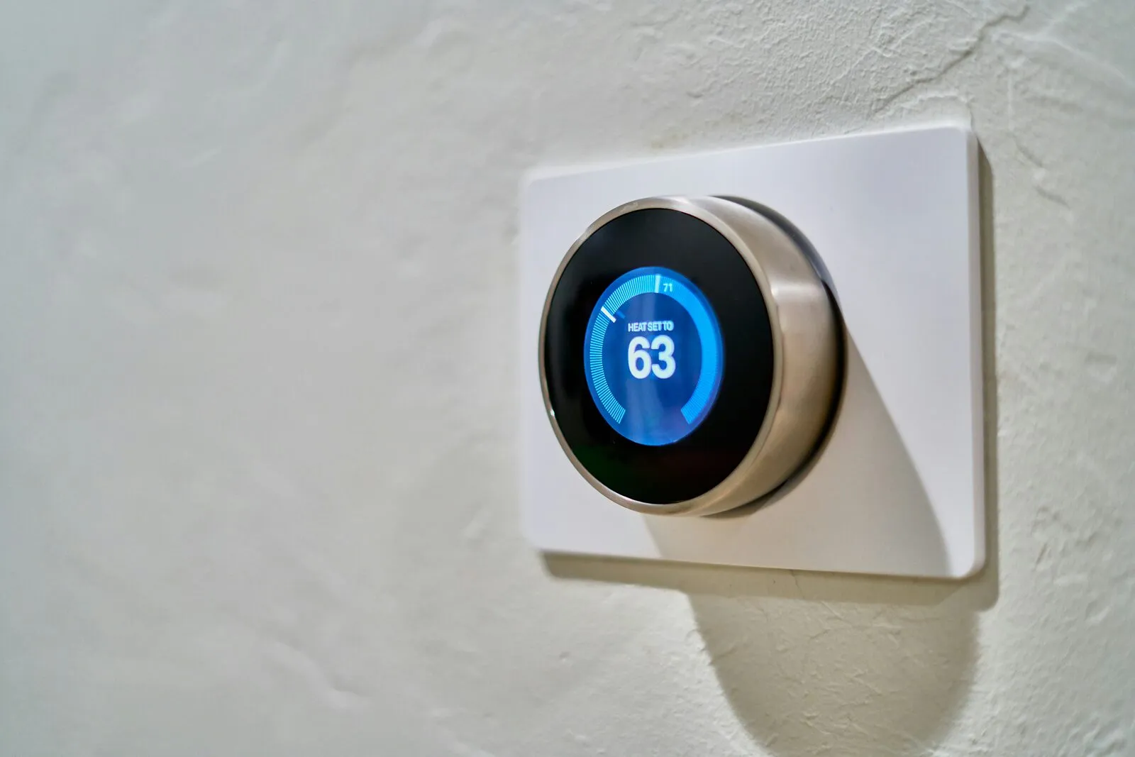 Illustrative stock photo — a wall thermostat showing a setpoint; not an actual Lake Havasu AC Guide job site.